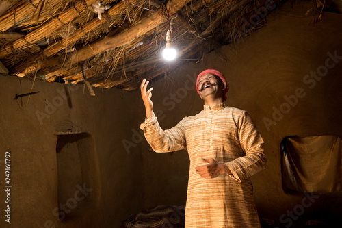 Rural Indian man delighted on electricity reaching her home