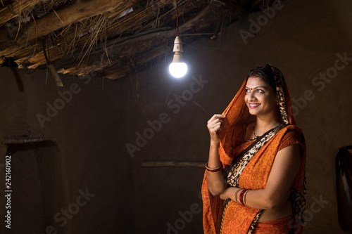 Rural Indian woman delighted on electricity reaching her home