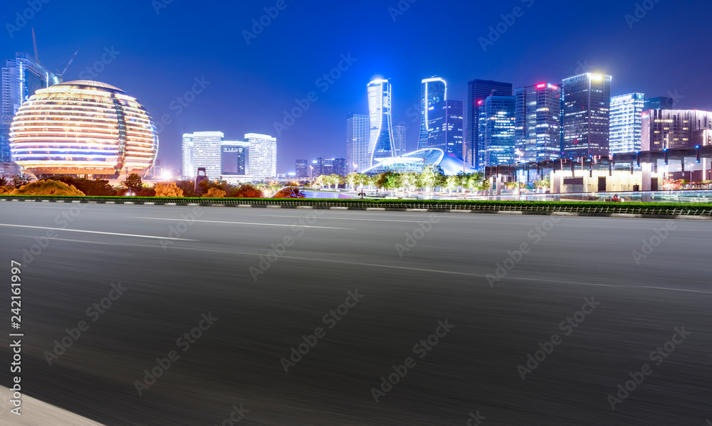 Obraz premium Road Pavement and Night View of Hangzhou Urban Architecture..