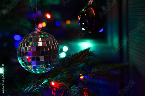 Mirror ball on decorated Chrismas Tree,Pine, New year, chrismas lighs closeup