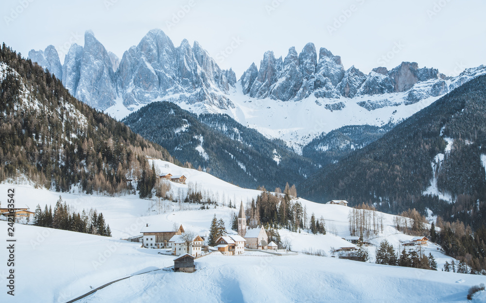 Dolomites peaks with Val di Funes village in winter, South Tyrol, Italy