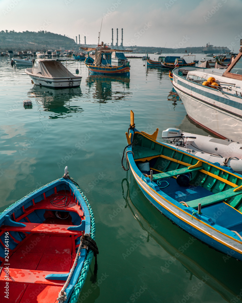 Boats on the bay in Marsaxlokk market in Malta.