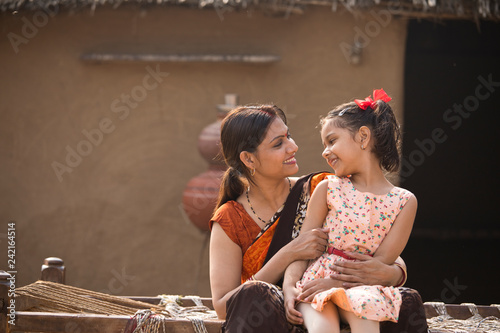 portrait of loving Indian mother and daughter at village