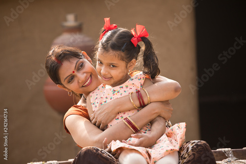 portrait of loving Indian mother and daughter at village