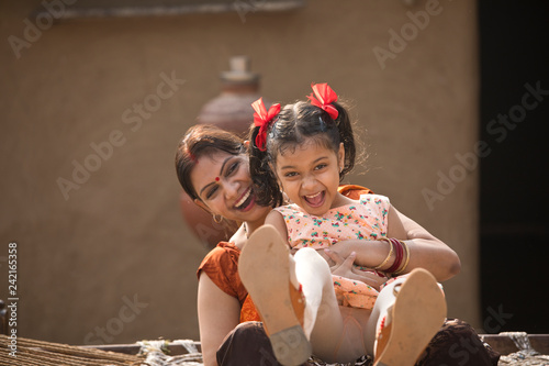 portrait of loving Indian mother and daughter at village