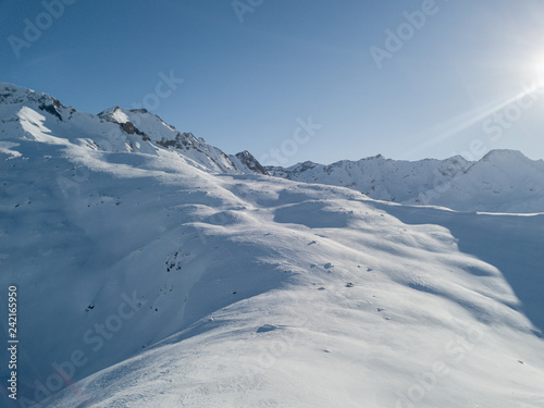 Aerial view of snow covered mountains in swiss alps