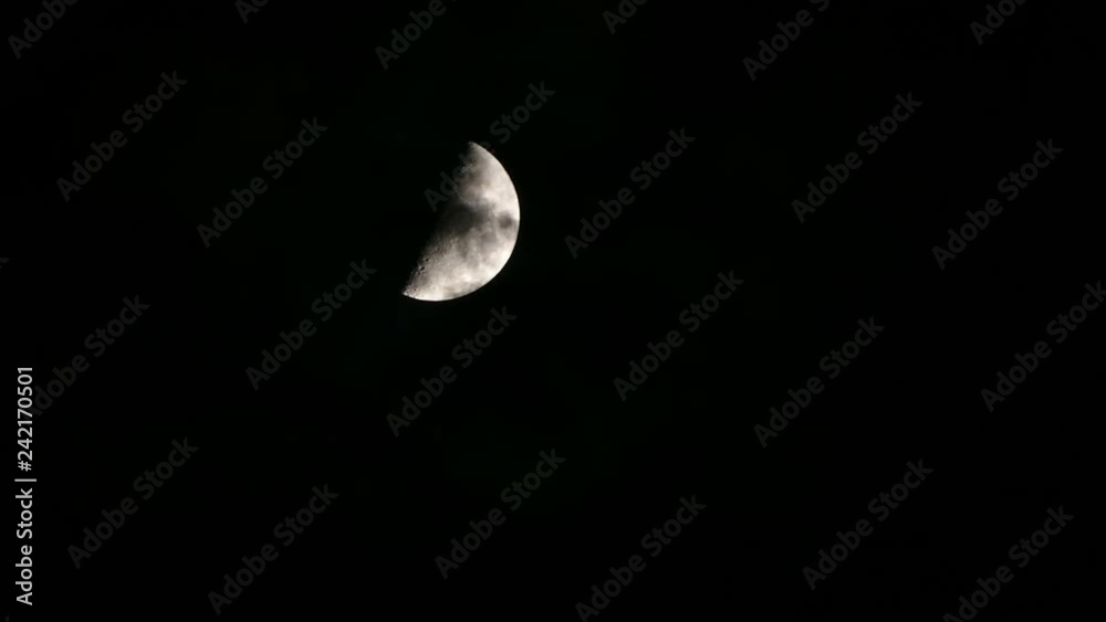 Crescent moon motion, with some clouds passing by in front, giving a sense of fantasy and mystery.Time Lapse. Crescent moon motion, with some clouds passing by in front, giving a sense of fantasy and mystery.Time Lapse.