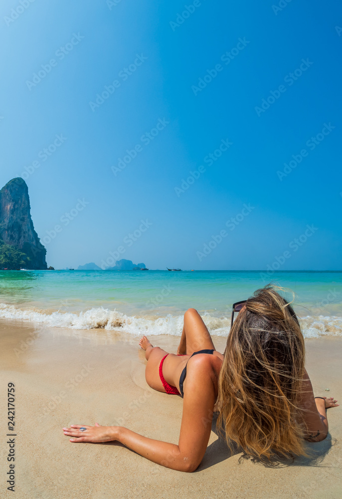 woman resting at the tropical Thailand Railay beach woman resting at the tropical Thailand Railay beach