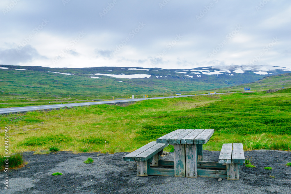 Picnic table and landscape near the Isafjordur fjord Picnic table and landscape near the Isafjordur fjord