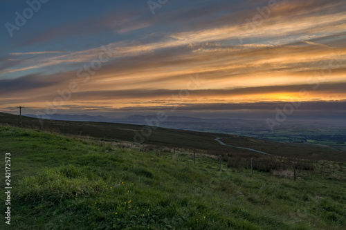 View over Greenfell Raise from Hartside Top on the A686 between Alston and Melmerby, Cumbria, England, UK - with the Lake District in the foggy background