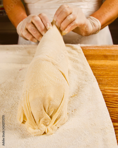 human hands cooking homemade strudel