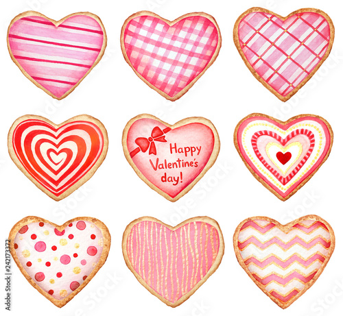 Collection of watercolor heart shaped cookies and candies decorated with glaze on white background for Valentine s day designs.
