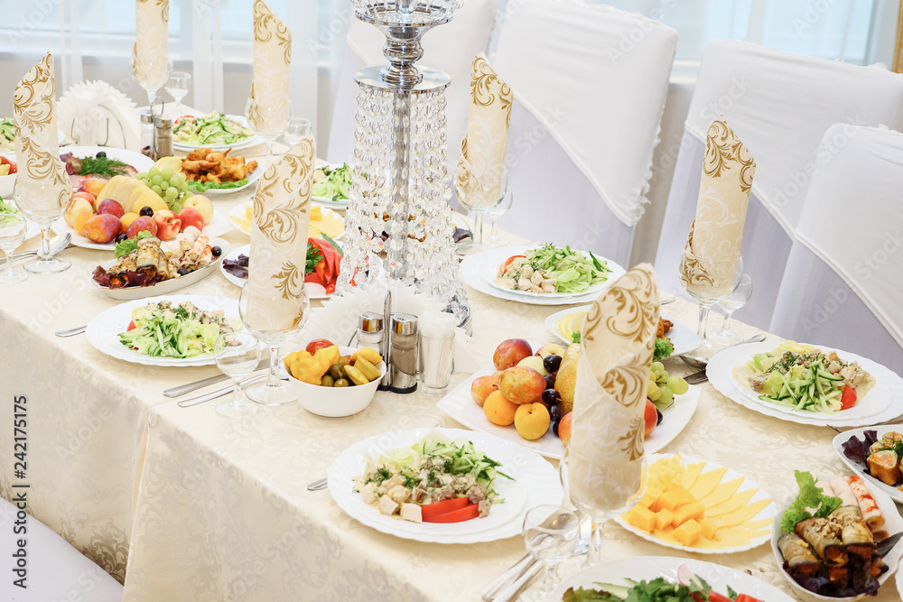 table set service with silverware and glass stemware at restaurant before party table set service with silverware and glass stemware at restaurant before party