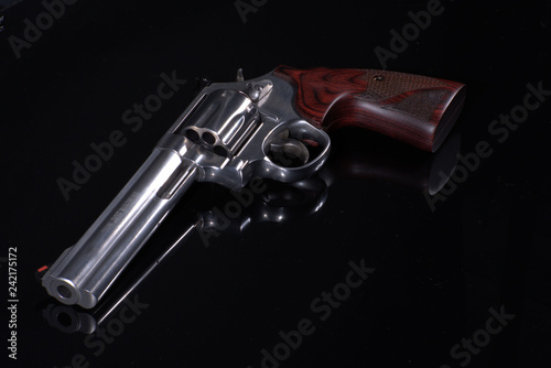 Revolver on black background
