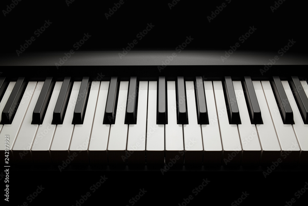 Piano keyboard on black background