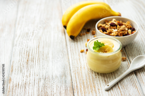 Banana yogurt, granola and fresh bananas