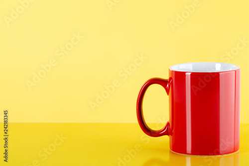 Red cup mug drink on yellow background