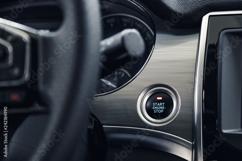 Engine Start Stop button of a modern car. The interior of the expensive car
