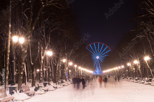 evening in Kharkiv winter park and street lamp. Christmas city lights
