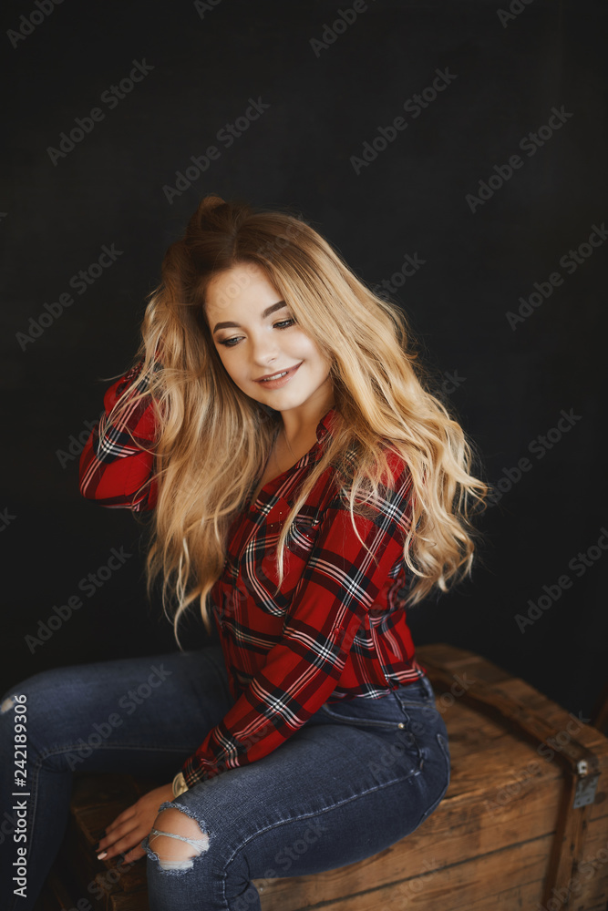 Plus size sexy model girl, fashionable blonde with bright makeup and with a  beautiful smile in