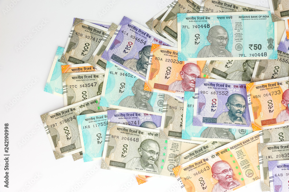 Close up view of brand new indian 10, 50, 100, 200, 500 and 2000 rupees banknotes. Colorful money background.