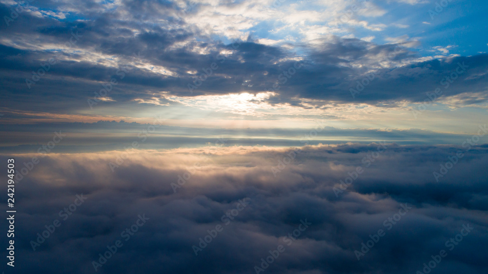 Aerial view of the heaven. Heavenly sunrise above the clouds. View from the window in the plane. Walking in the cloud. Aerial view of the heaven. Heavenly sunrise above the clouds. View from the window in the plane. Walking in the cloud.