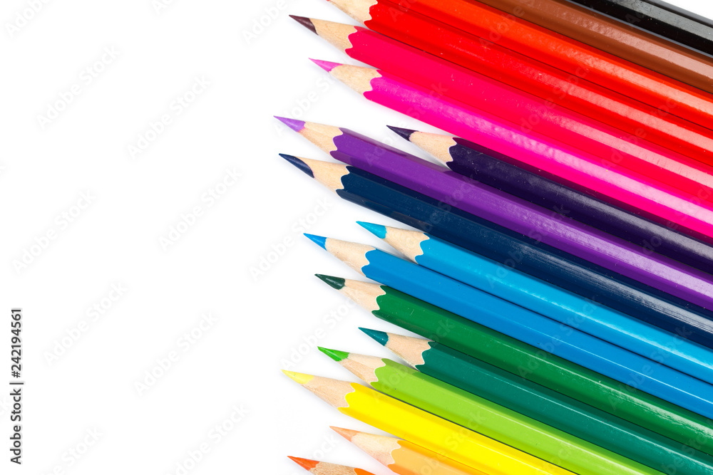 Colour pencils on white background, top view. Colour pencils on white background, top view.
