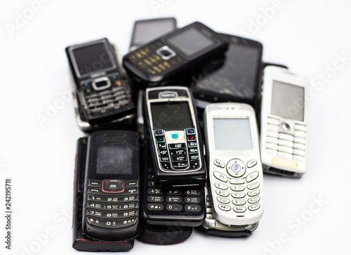 bunch of old cell phones mobile communication retro broken white button tube photo