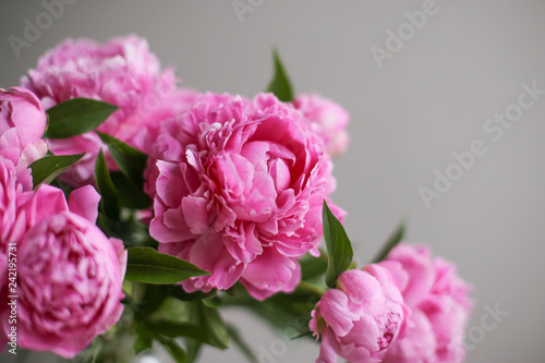Flowers composition. Pink peony flowers on wooden background. Mothers day. Flat lay, top view.