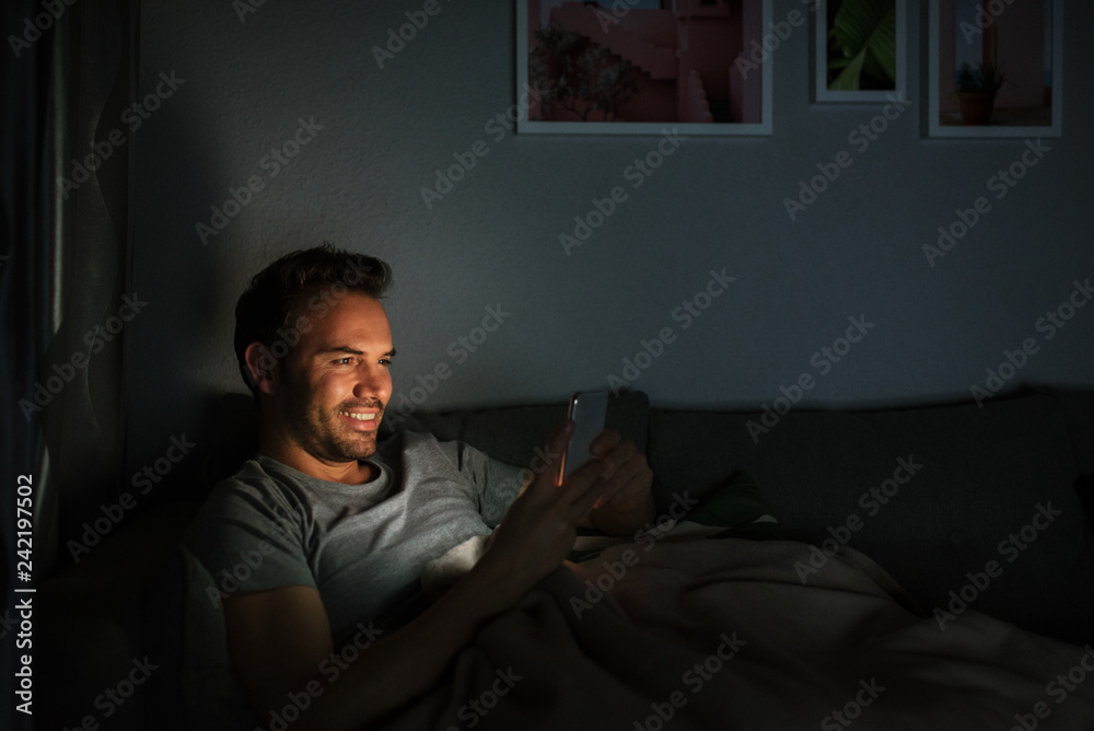 Man in pajamas with a mobile phone