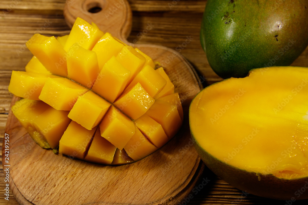 Fresh mango fruit on wooden table