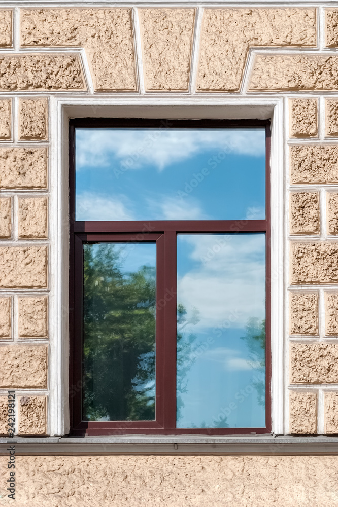 Fototapeta premium Reflection of the sky in the window.