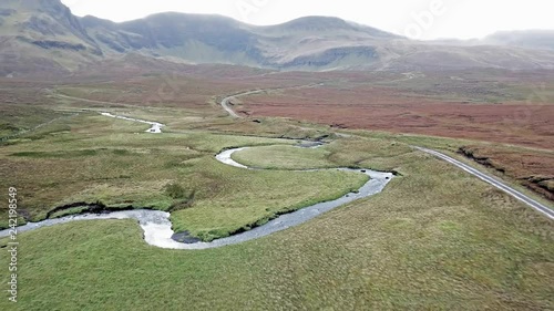 Flying over the River Lealt and Single track at Loch Cuithir and Sgurr a Mhadaidh Ruadh - Hill of the Red Fox, Isle of Skye, Scotland photo