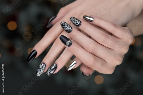 Close up on beautiful female hands with  Nail Art  manicure.