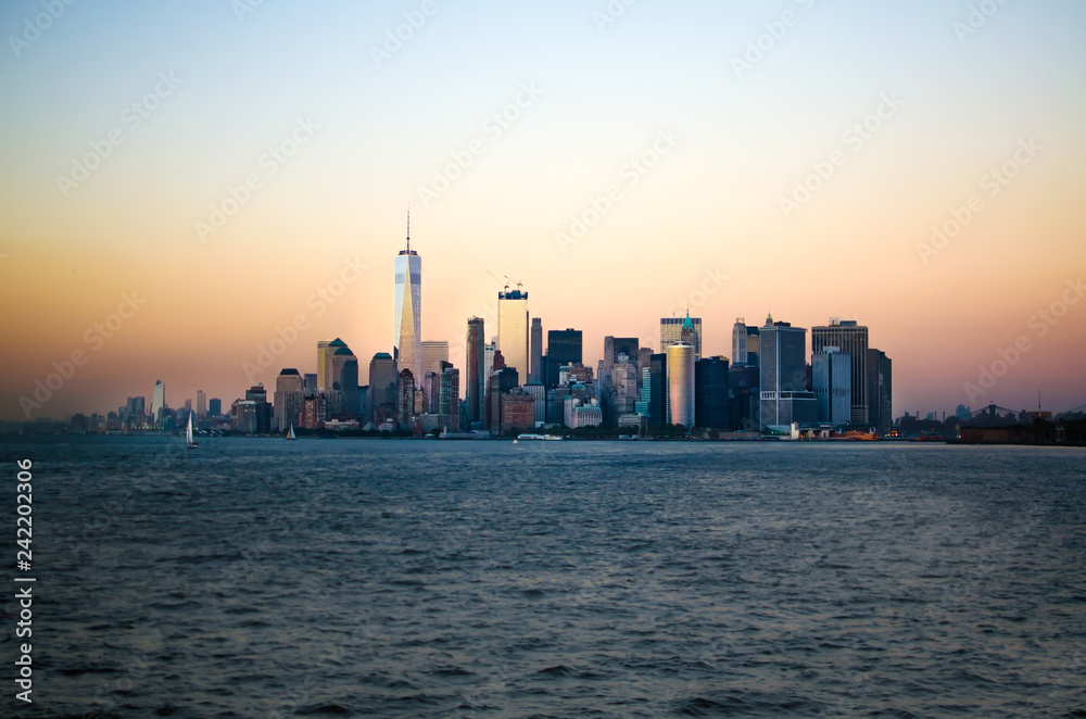 Approaching the Lower Manhatten skyline at sunset from Staten Island, New York City, United States