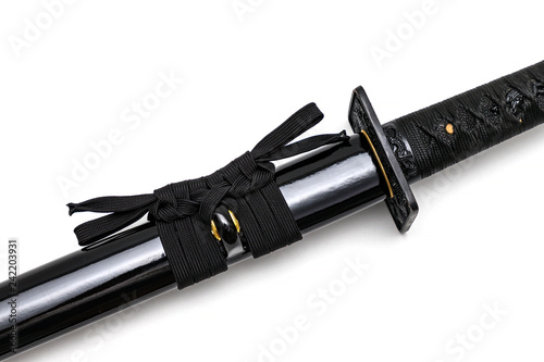 Black Sageo (cord) for tie the saya (scabbard) of Japanese sword isolated in white background. photo