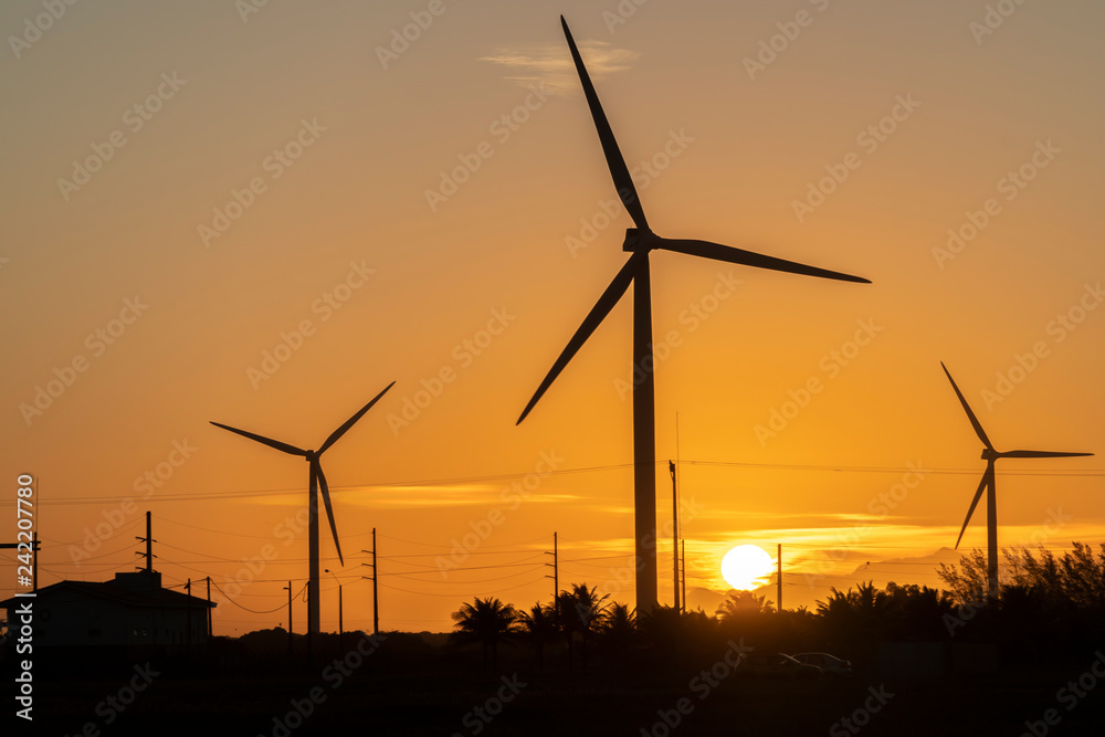 Wind turbines at sunset in Gargau, Brazil