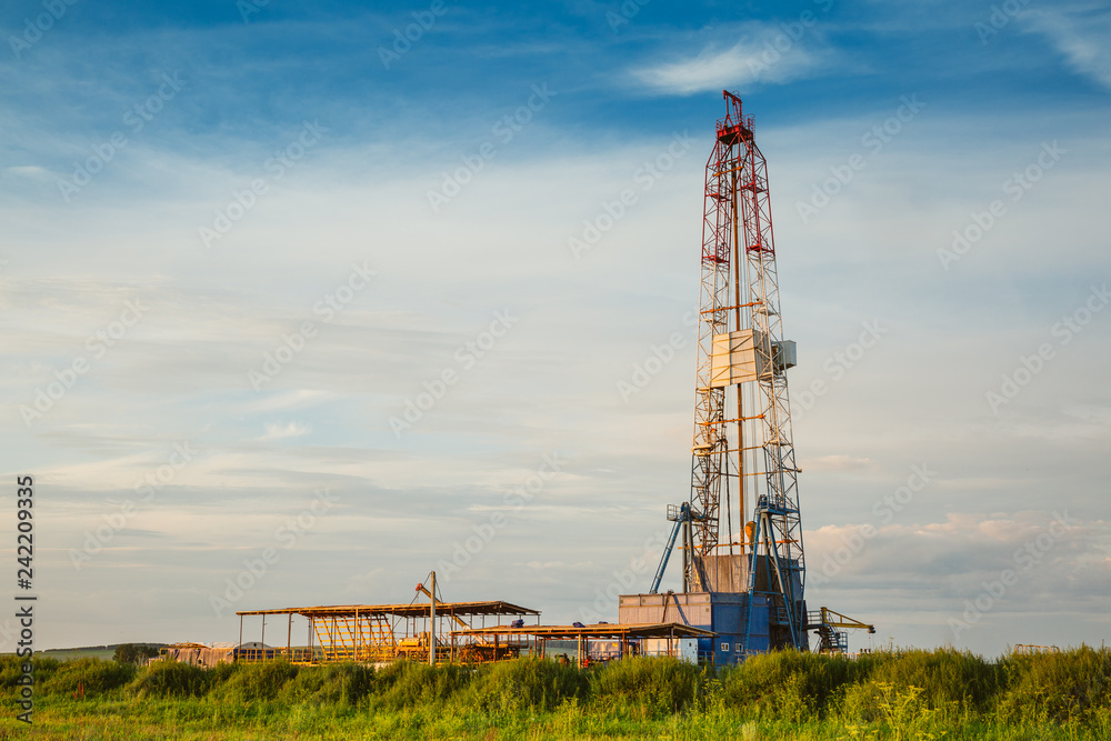 Drilling rig in oil field for drilled into subsurface in order to produced crude. Petroleum Industry Drilling rig in oil field for drilled into subsurface in order to produced crude. Petroleum Industry