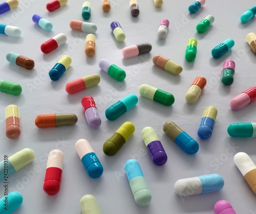 Colour-coded medical capsules, illustration photo