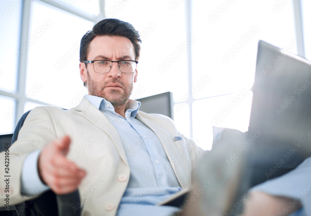 close up.a successful man with a laptop. close up.a successful man with a laptop.