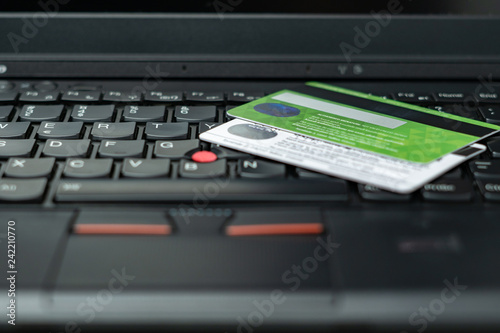 Wallpaper Mural Online banking. Money management on the internet. Financial accounts. Credit or debit bank card on the black laptop with black keys. Torontodigital.ca