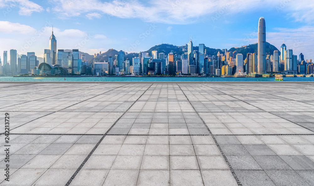 Empty marble floors and city views under the blue sky Empty marble floors and city views under the blue sky