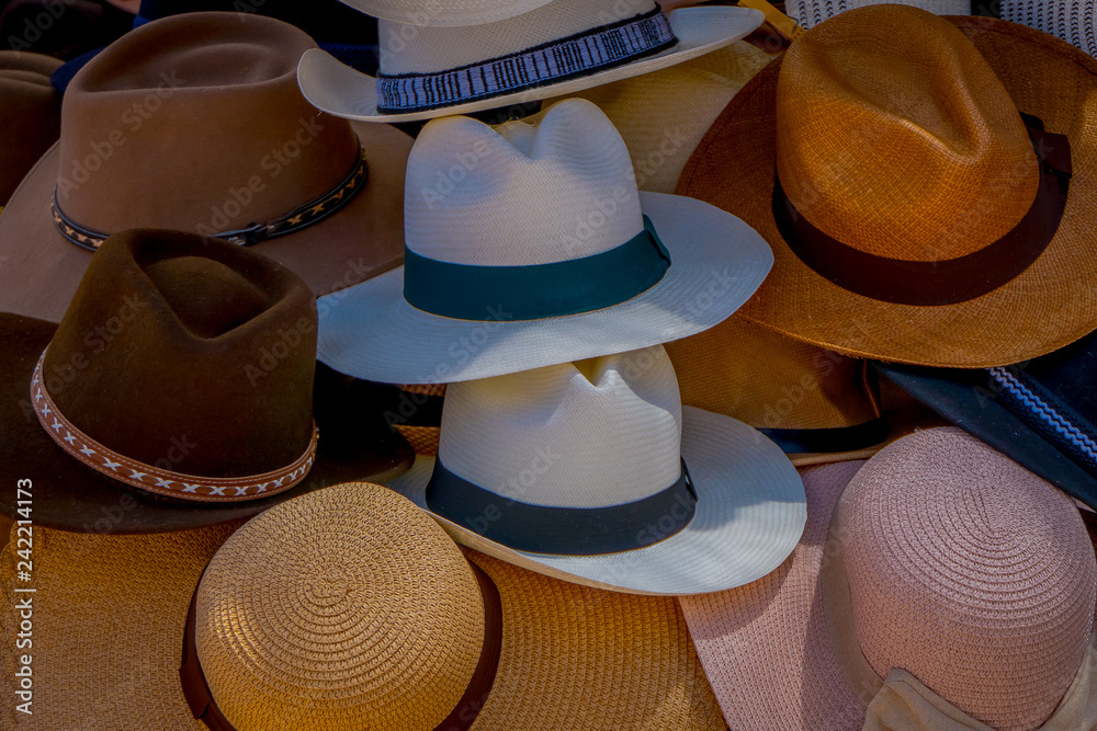 Outdoor view of market stall with panama hats in street market in Otavalo