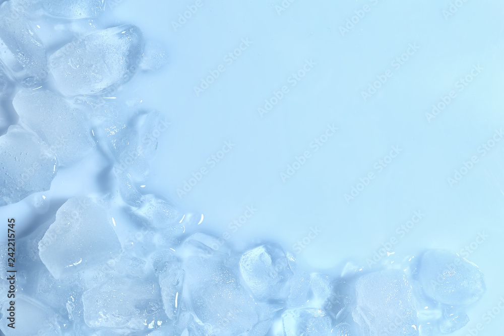 Melting ice cubes on color background, top view. Space for text