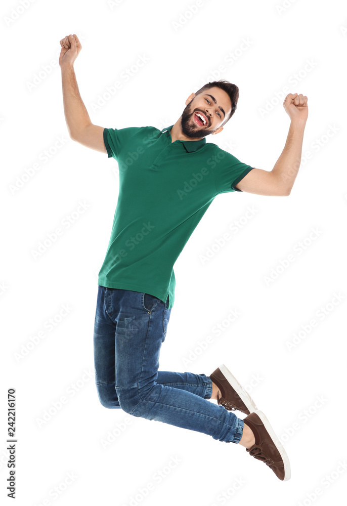 Happy young man jumping on white background. Celebrating victory Happy young man jumping on white background. Celebrating victory