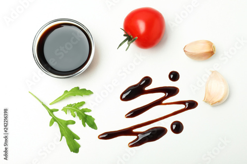 Composition with balsamic vinegar isolated on white, top view photo