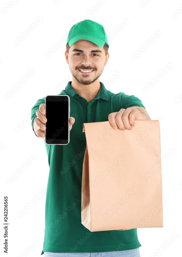 Young man holding paper bag and smartphone isolated on white, mockup for design. Online food delivery Young man holding paper bag and smartphone isolated on white, mockup for design. Online food delivery