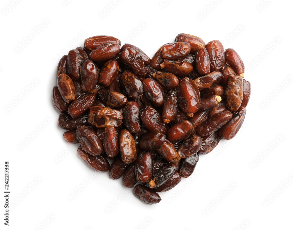 Obraz premium Heart shaped pile of sweet dried date fruits isolated on white, top view
