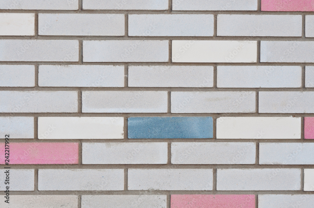 Brick wall with colored bricks. City backgrounds. Brick wall with colored bricks. City backgrounds.