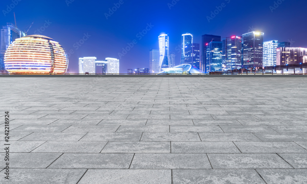 Fototapeta premium Urban skyscrapers with empty square floor tiles
